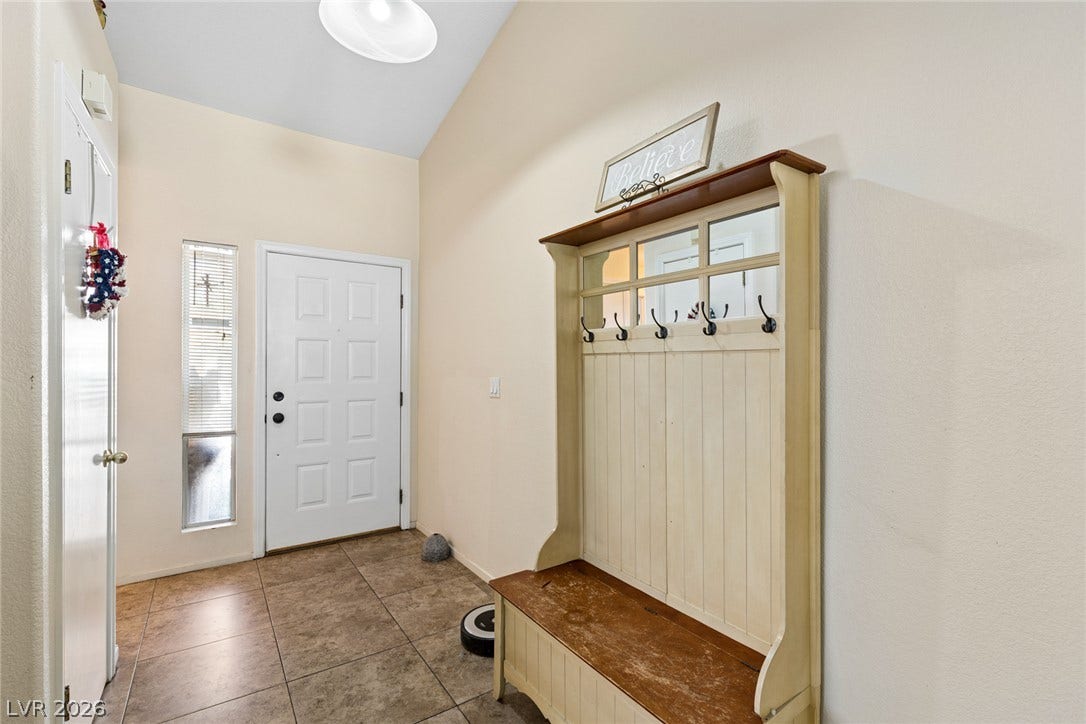 1747 Ashburn Drive, North Las Vegas, NV 89032 A welcoming entryway with tile flooring and high ceilings creates an inviting first impression.