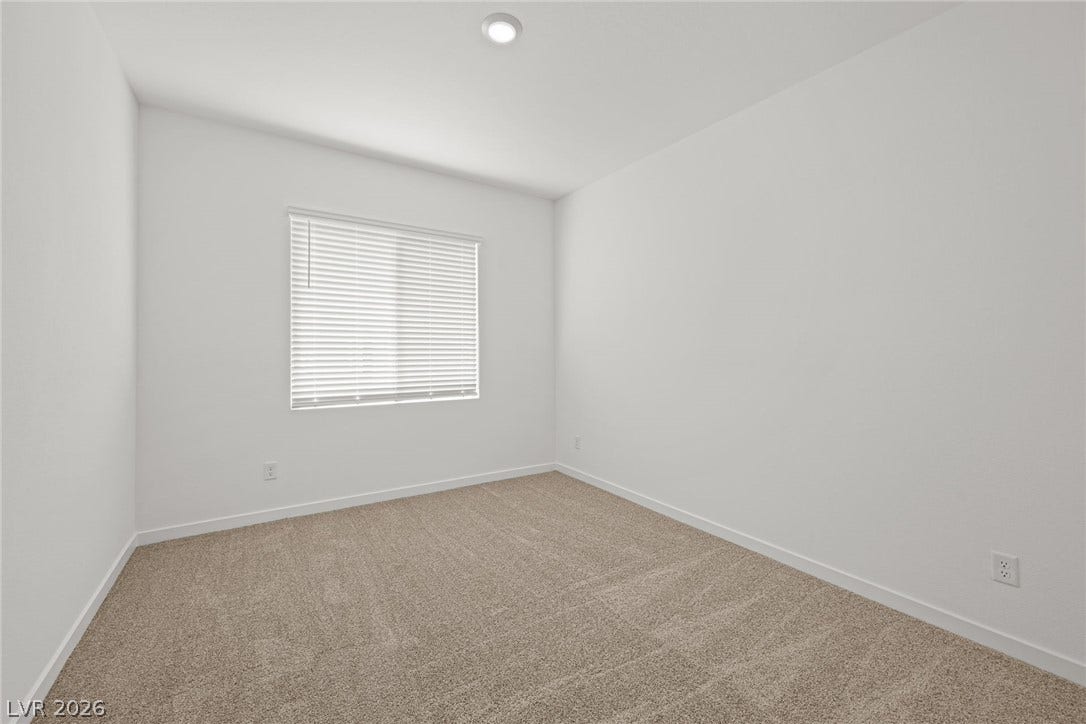 8142 Gusty Brook Street, Las Vegas, NV 89113 Plush carpeting and recessed lighting create a comfortable, versatile interior space.