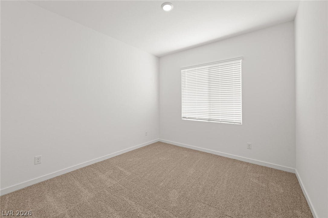 8142 Gusty Brook Street, Las Vegas, NV 89113 Plush carpeting and recessed lighting create a comfortable, minimalist retreat.