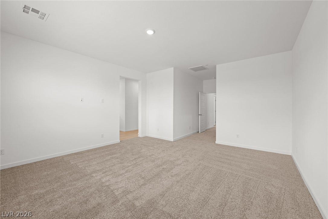 8142 Gusty Brook Street, Las Vegas, NV 89113 Plush wall-to-wall carpeting and crisp neutral walls define this versatile upstairs bonus room.