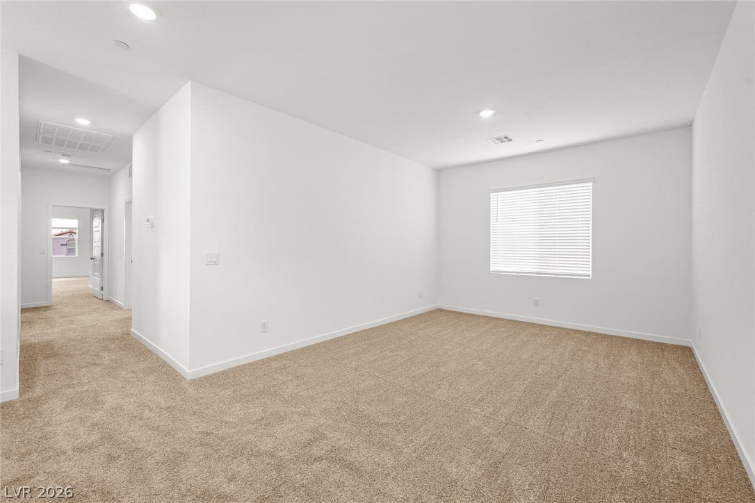 8142 Gusty Brook Street, Las Vegas, NV 89113 Plush carpeting and recessed lighting define this versatile upstairs loft area.