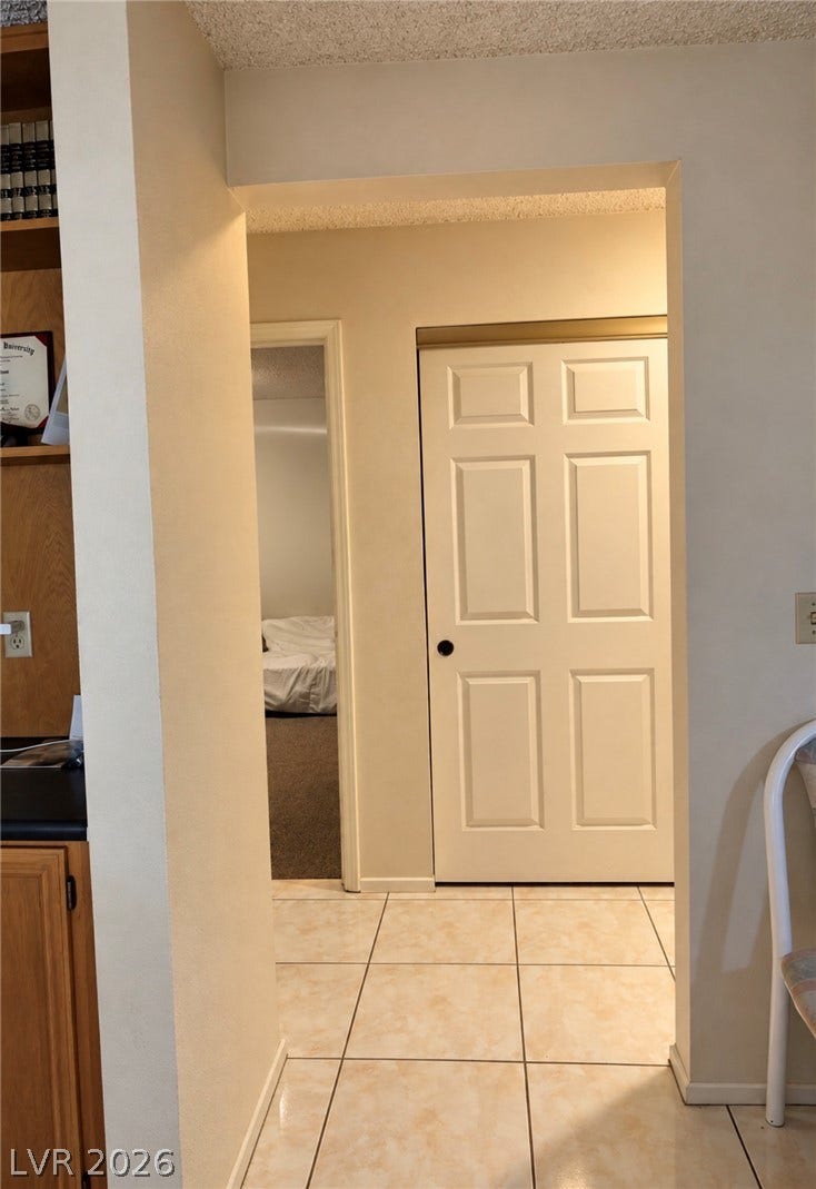101 Luna Way, #242, Las Vegas, NV 89145 Tiled flooring guides the transition from the main living area into cozy private rooms.
