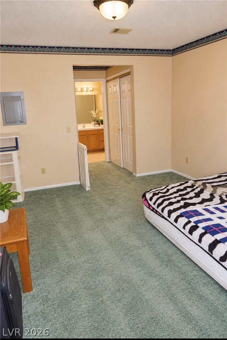 101 Luna Way, #242, Las Vegas, NV 89145 An attached bathroom and double closets highlight this carpeted master bedroom suite.