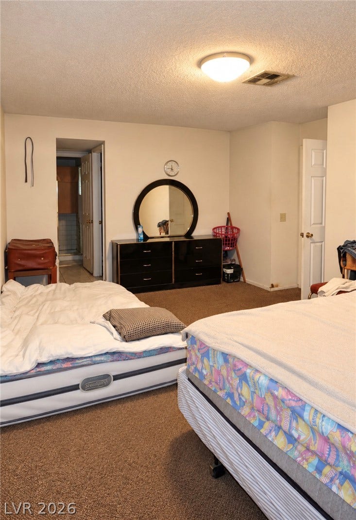 101 Luna Way, #242, Las Vegas, NV 89145 Plush wall-to-wall carpeting and neutral walls define this comfortable secondary bedroom.