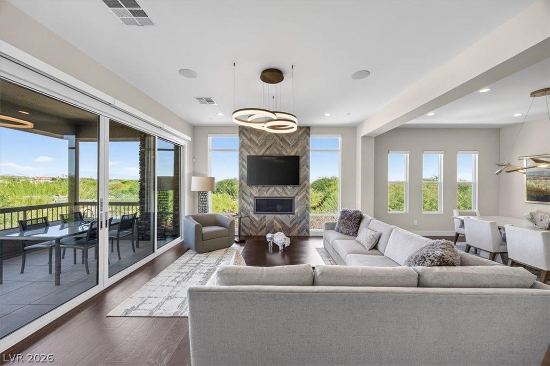 11280 Granite Ridge Drive, #1048, Las Vegas, NV 89135 An open floor plan connects the living area to a scenic covered balcony.