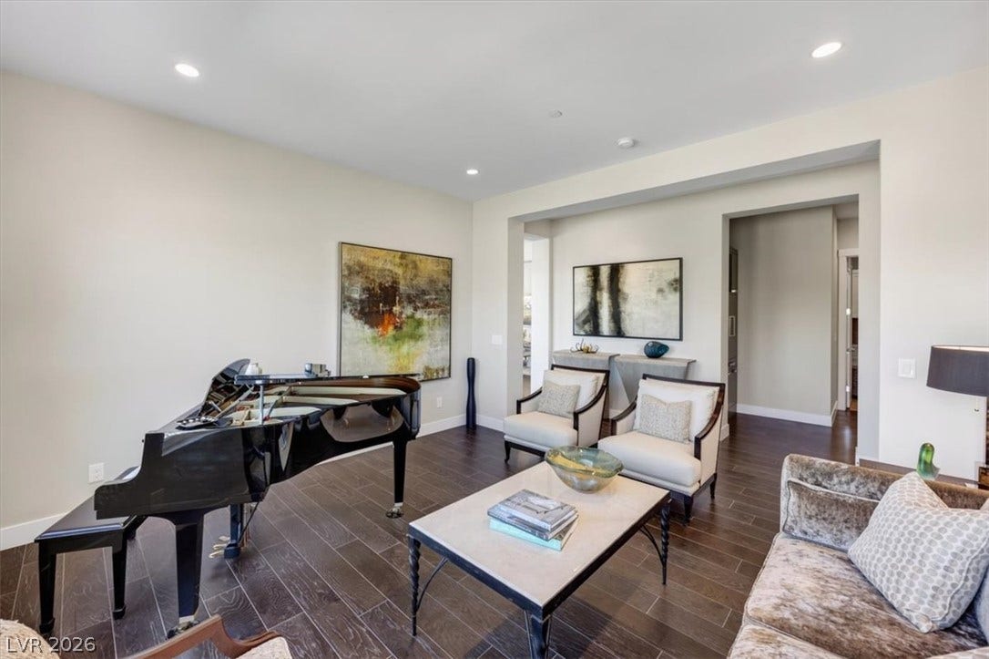 11280 Granite Ridge Drive, #1048, Las Vegas, NV 89135 Gleaming hardwood floors and recessed lighting anchor this versatile living space.