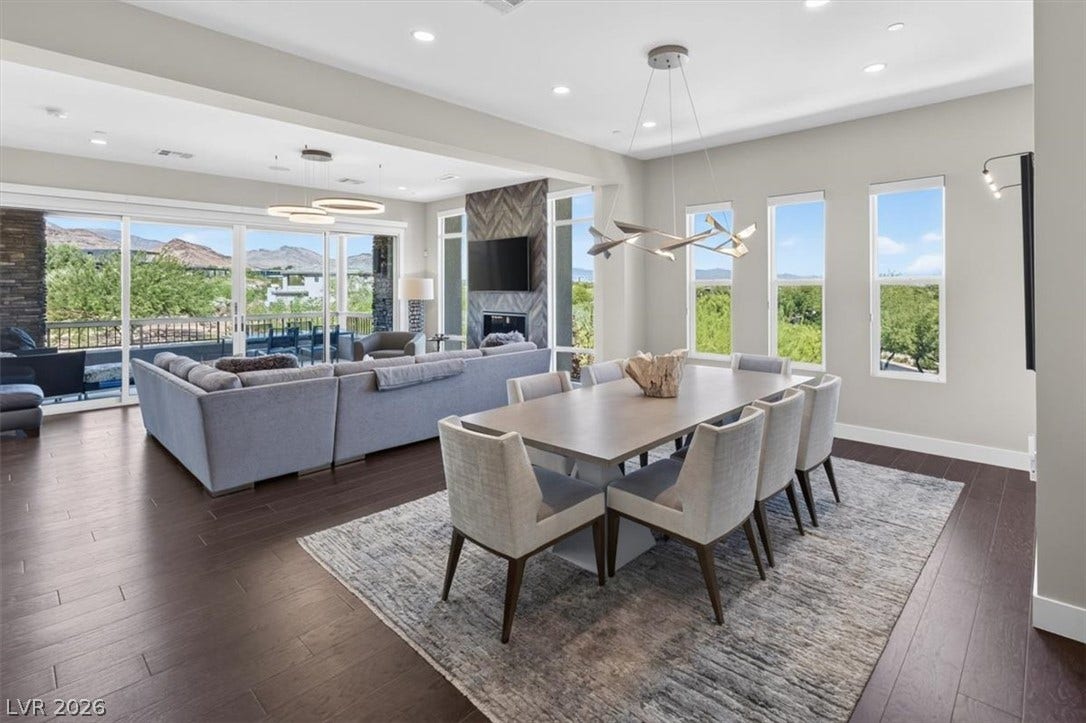 11280 Granite Ridge Drive, #1048, Las Vegas, NV 89135 Rich hardwood floors anchor this light-filled dining space opening directly to the living area.