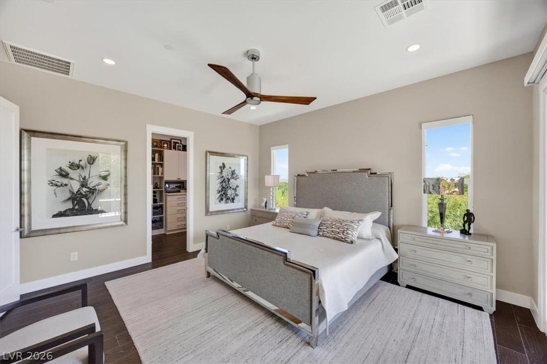 11280 Granite Ridge Drive, #1048, Las Vegas, NV 89135 Rich hardwood flooring anchors this serene sleeping space filled with natural light.