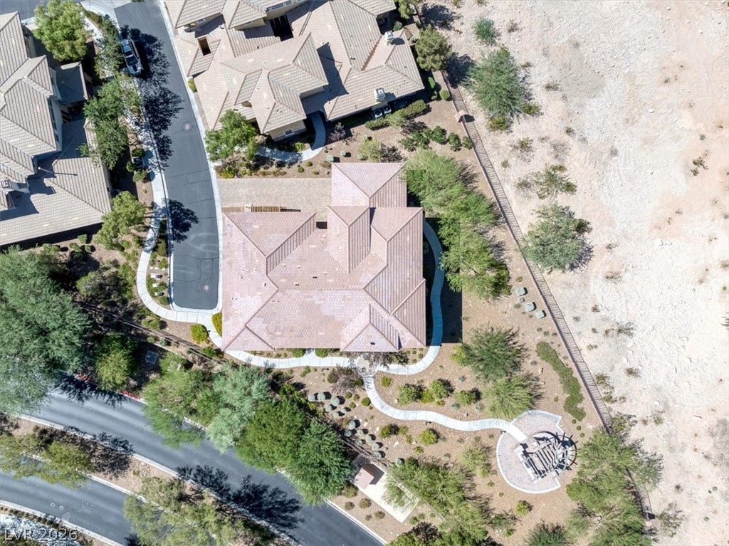 11280 Granite Ridge Drive, #1048, Las Vegas, NV 89135 An aerial perspective showcases the tiled roofline and desert landscaping surrounding the property.
