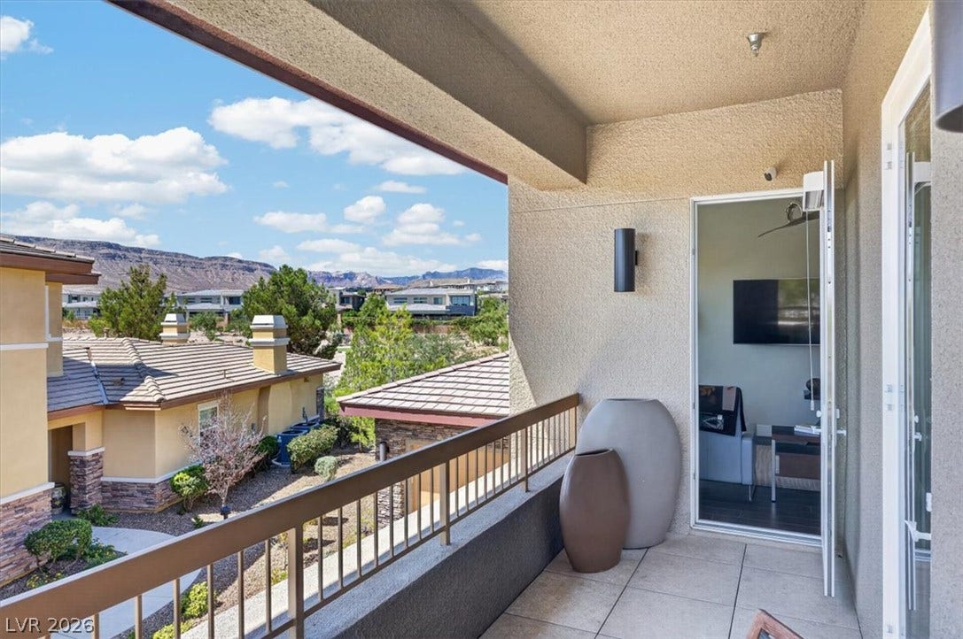 11280 Granite Ridge Drive, #1048, Las Vegas, NV 89135 A private covered terrace offers scenic views of the surrounding neighborhood and mountains.