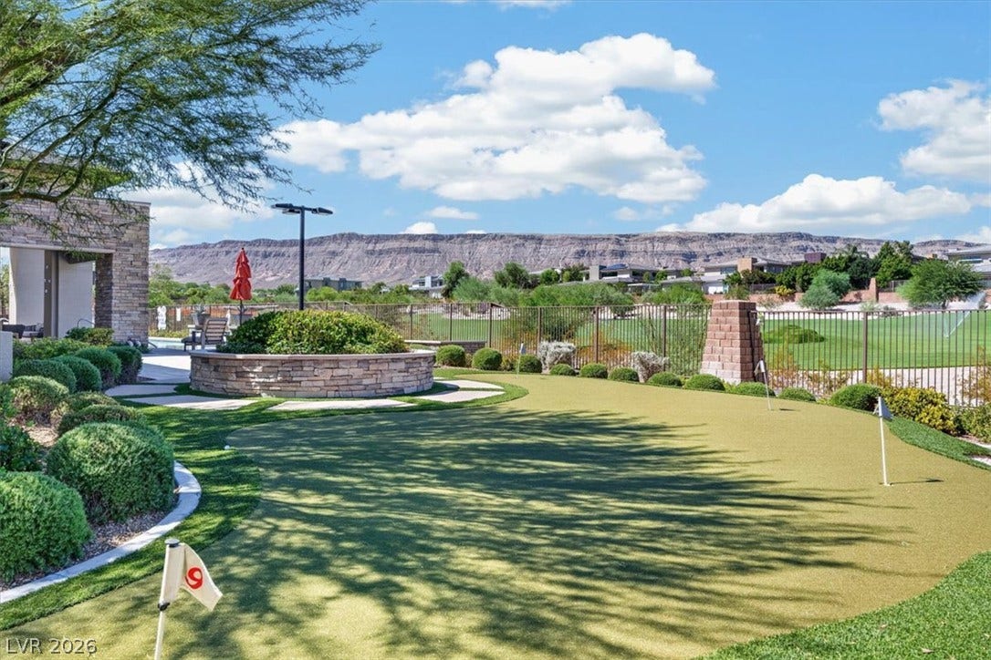 11280 Granite Ridge Drive, #1048, Las Vegas, NV 89135 Manicured putting green showcases sweeping mountain views and custom stone hardscaping.