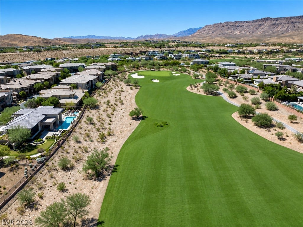11280 Granite Ridge Drive, #1048, Las Vegas, NV 89135 Dramatic mountain vistas provide a striking backdrop to this beautifully manicured golf course community.