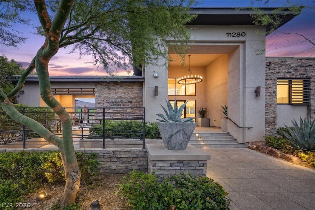 11280 Granite Ridge Drive, #1048, Las Vegas, NV 89135 Stone accents and a grand covered entryway define this contemporary community clubhouse exterior.