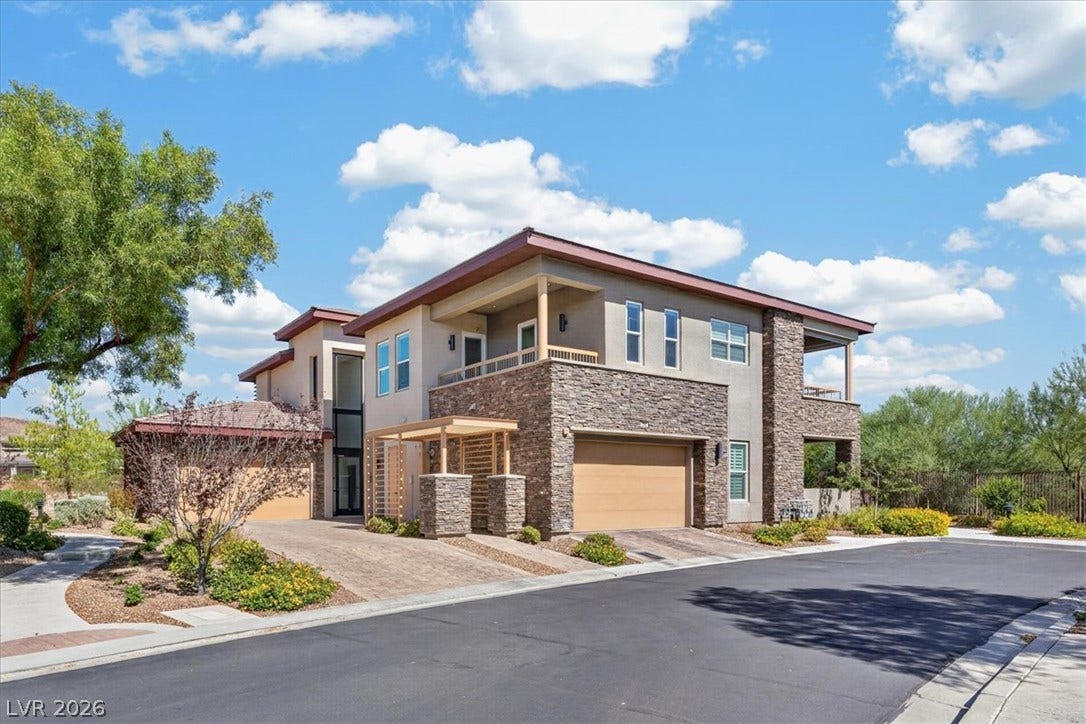 11280 Granite Ridge Drive, #1048, Las Vegas, NV 89135 Bold stone accents and multiple balconies define this contemporary multi-level exterior.