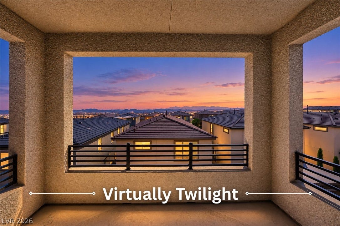 Sunset colors paint the horizon beyond this covered balcony framed by textured stucco pillars.