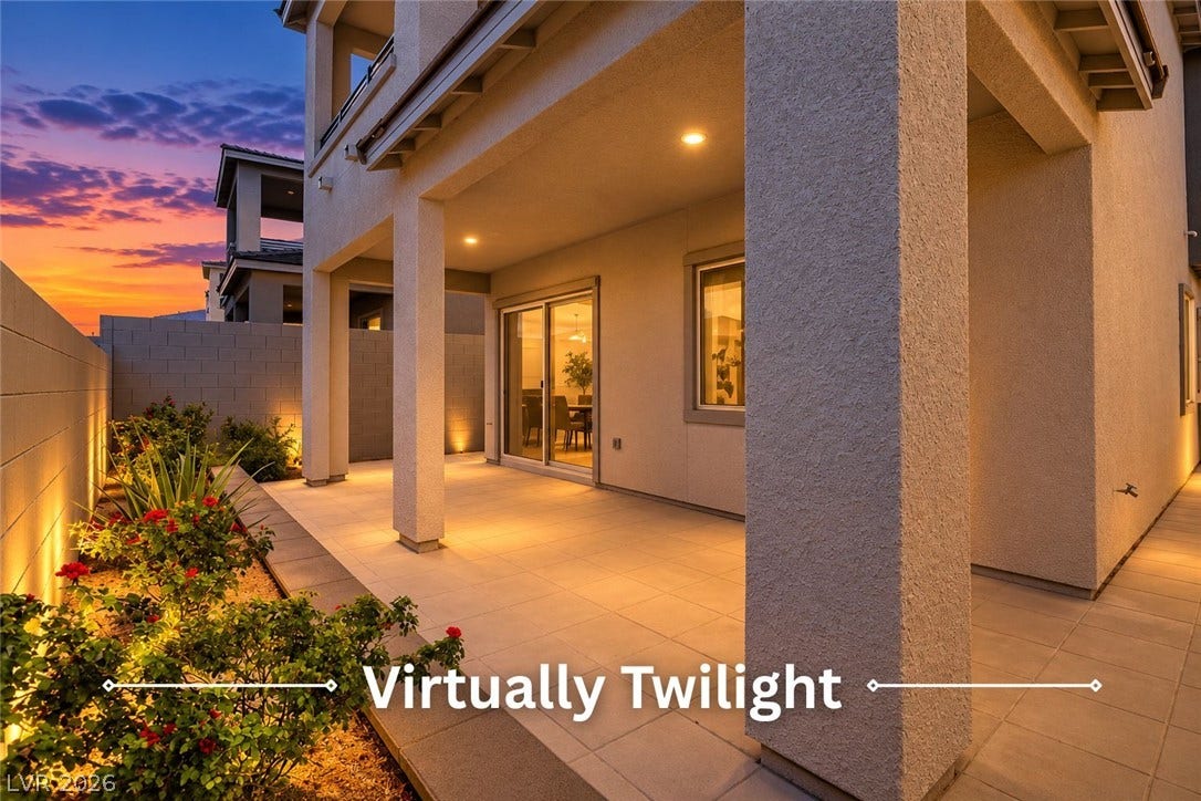 An inviting covered patio offers tiled flooring and substantial stucco pillars alongside a private courtyard.