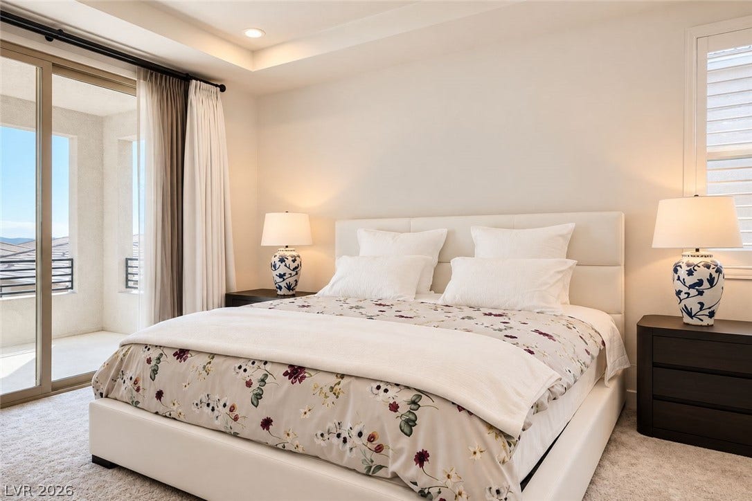 Sliding glass doors open to a private balcony from this quiet bedroom suite.