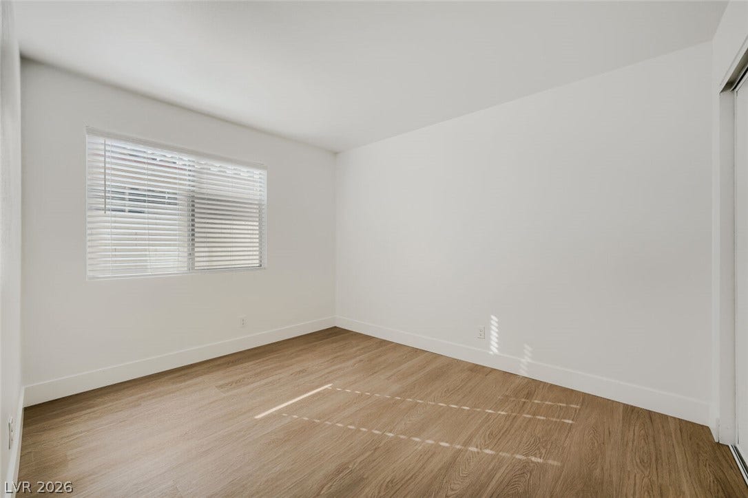 5736 Baffy Circle, Las Vegas, NV 89142 Smooth plaster walls and warm wood-style flooring create a clean, versatile modern space.