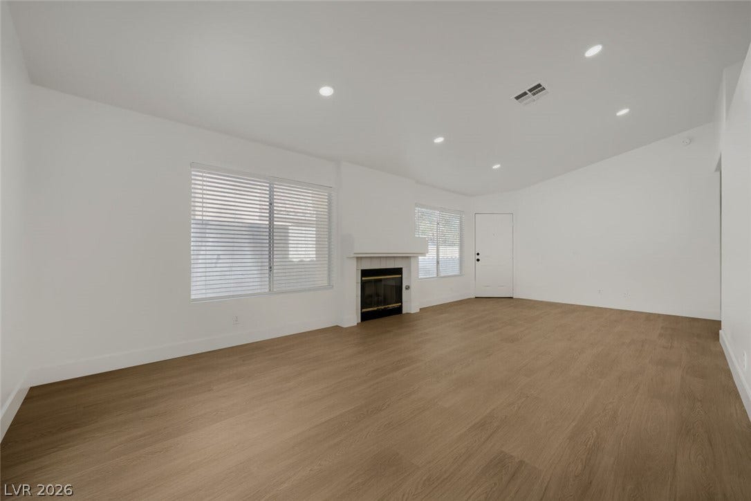 5736 Baffy Circle, Las Vegas, NV 89142 An inviting fireplace serves as the focal point in this airy room with handsome flooring.