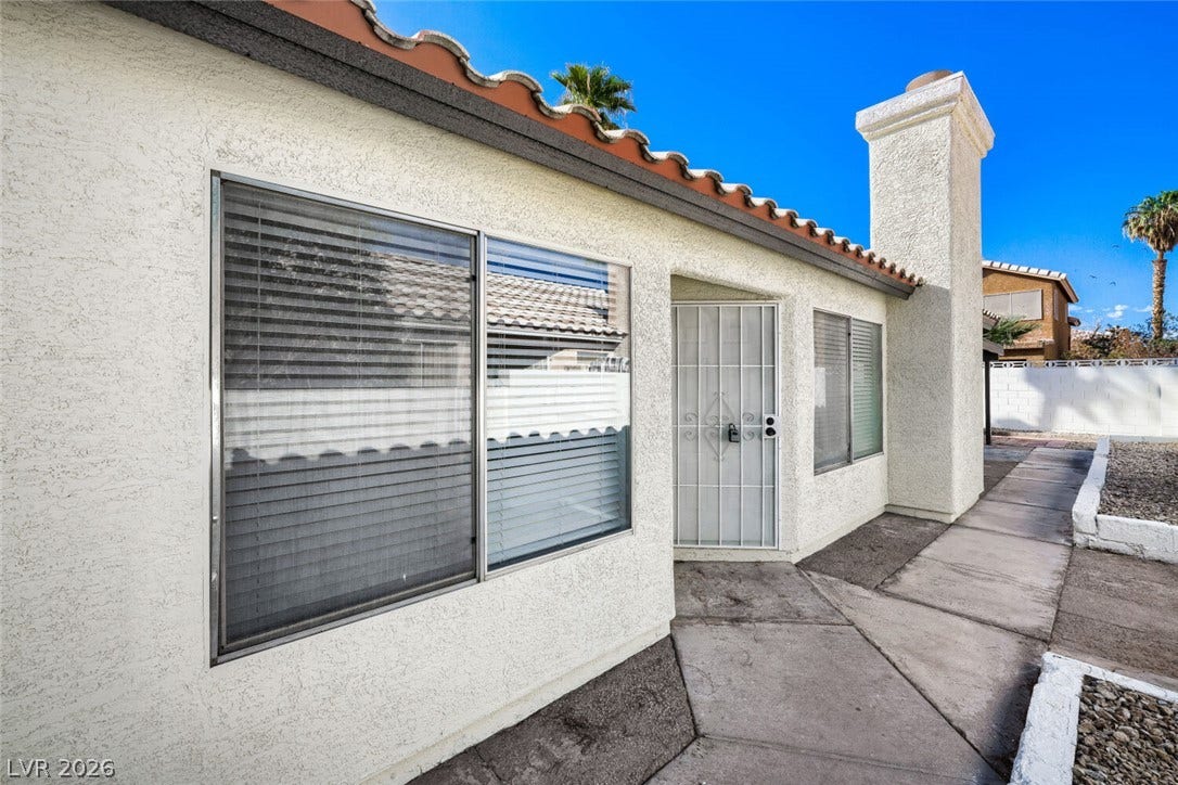 5736 Baffy Circle, Las Vegas, NV 89142 Stucco walls and a tiled roof define the exterior of this classic desert home.