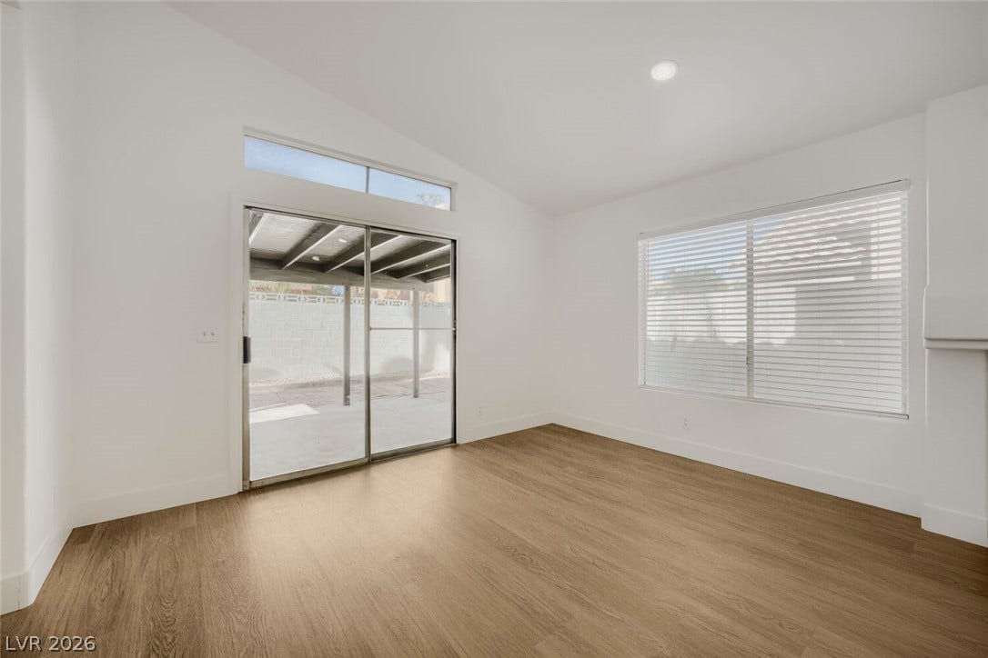 5736 Baffy Circle, Las Vegas, NV 89142 Sliding glass doors open directly to the covered patio from this airy room.