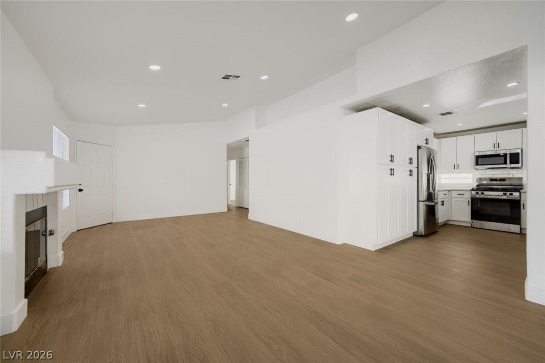 5736 Baffy Circle, Las Vegas, NV 89142 Smooth wood floors flow seamlessly through this open layout connecting the main living area and kitchen.