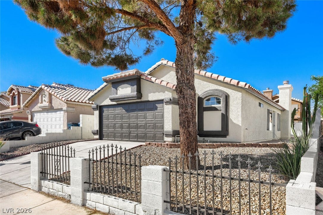 5736 Baffy Circle, Las Vegas, NV 89142 Spanish tile roofing and a private gated courtyard entry highlight this classic stucco home.