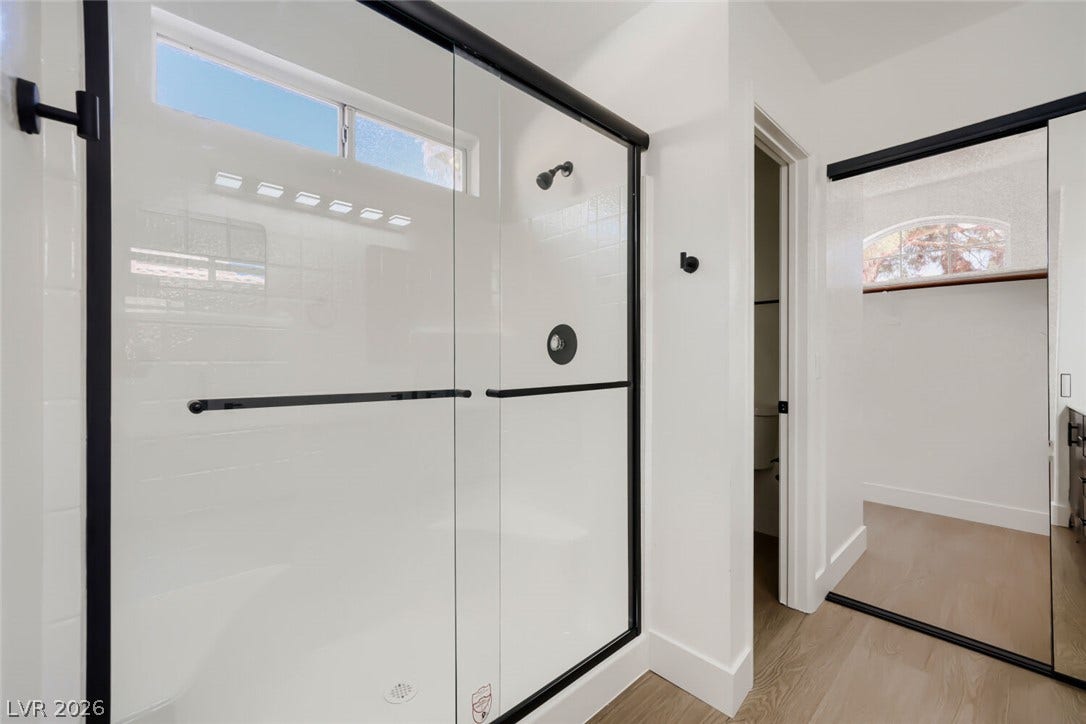 5736 Baffy Circle, Las Vegas, NV 89142 Clean lines and modern finishes define this sleek walk-in shower area.