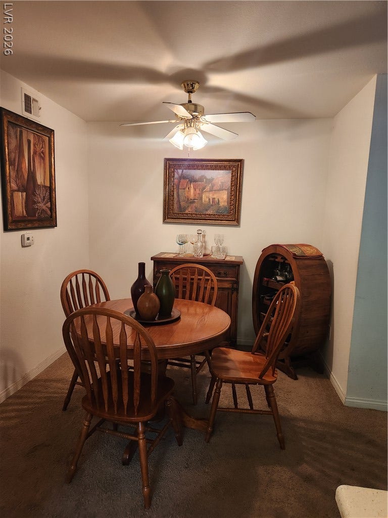 231 W Horizon Ridge Parkway, #924, Henderson, NV 89012 A cozy dining area features soft carpet flooring and an open layout connecting nearby rooms.