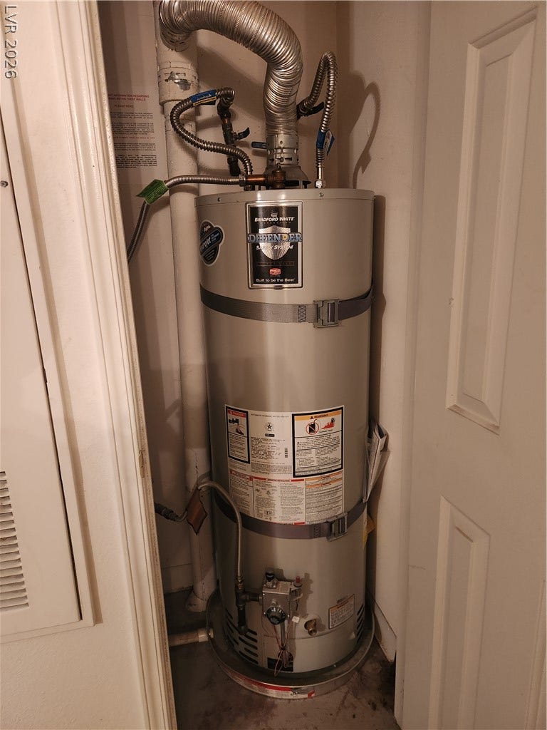 231 W Horizon Ridge Parkway, #924, Henderson, NV 89012 A modern gas water heater is neatly secured within a dedicated utility closet.