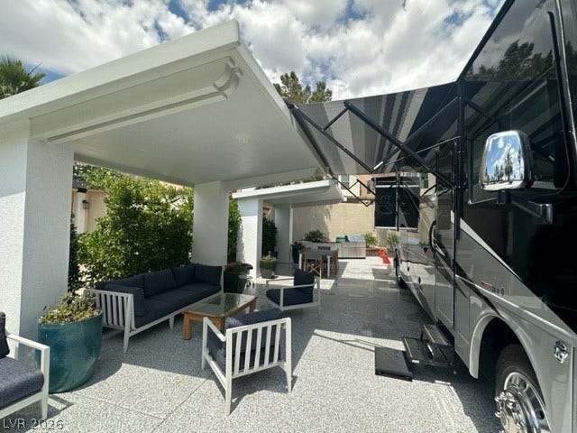 8175 Arville Street, #236, Las Vegas, NV 89139 A spacious covered patio layout accommodates motorhome parking alongside comfortable outdoor living spaces.