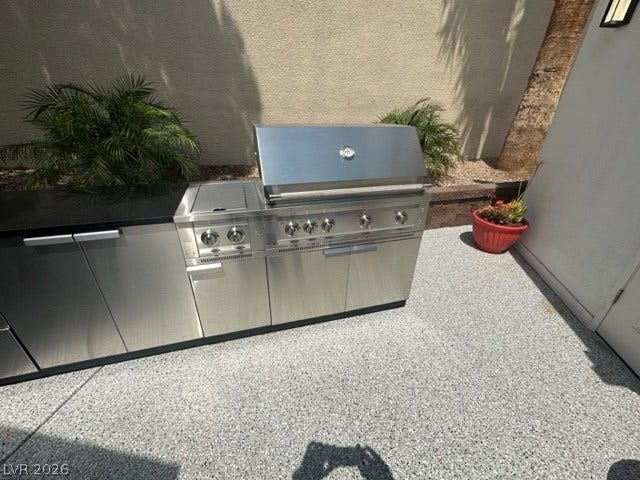 8175 Arville Street, #236, Las Vegas, NV 89139 A built-in stainless steel barbecue grill anchors this functional outdoor cooking area.