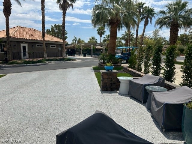 8175 Arville Street, #236, Las Vegas, NV 89139 Palm trees surround a spacious paved patio area ideal for enjoying warm desert breezes.