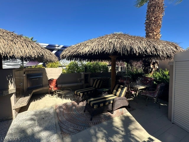 8175 Arville Street, #266, Las Vegas, NV 89139 A private paved courtyard provides a serene retreat framed by tropical thatched umbrellas.