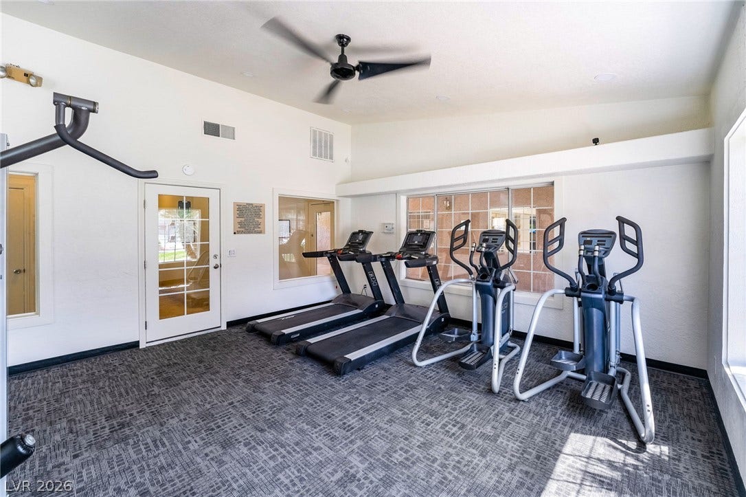 230 Mission Catalina Lane, #202, Las Vegas, NV 89107 High ceilings and durable patterned flooring create a functional atmosphere in this fitness space.