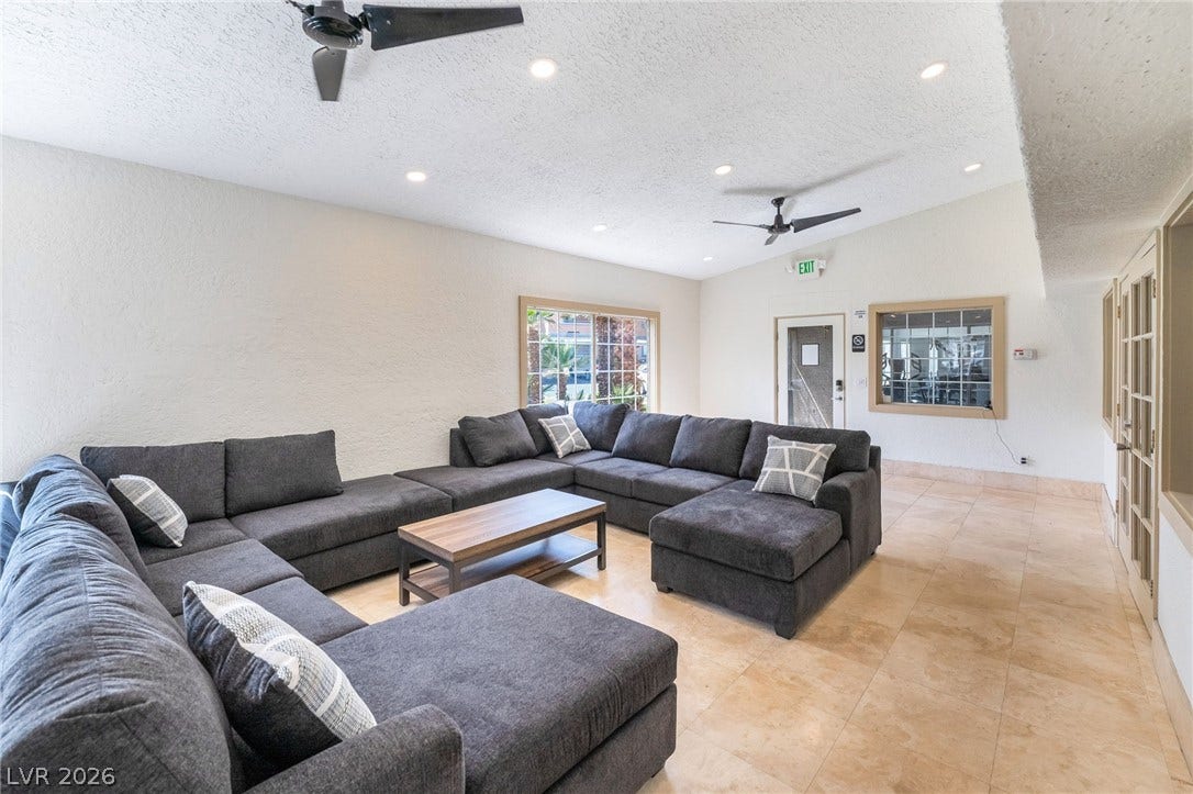 230 Mission Catalina Lane, #202, Las Vegas, NV 89107 Gleaming tile floors complement the vaulted ceiling and recessed lighting in this comfortable gathering space.