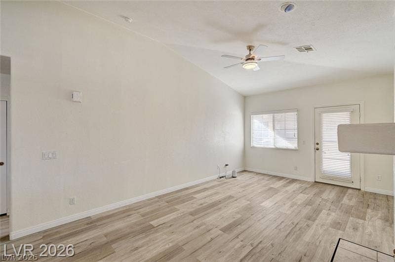3327 Erva Street, #207, Las Vegas, NV 89117 Angled ceilings and wood-style flooring elevate this comfortable living area.
