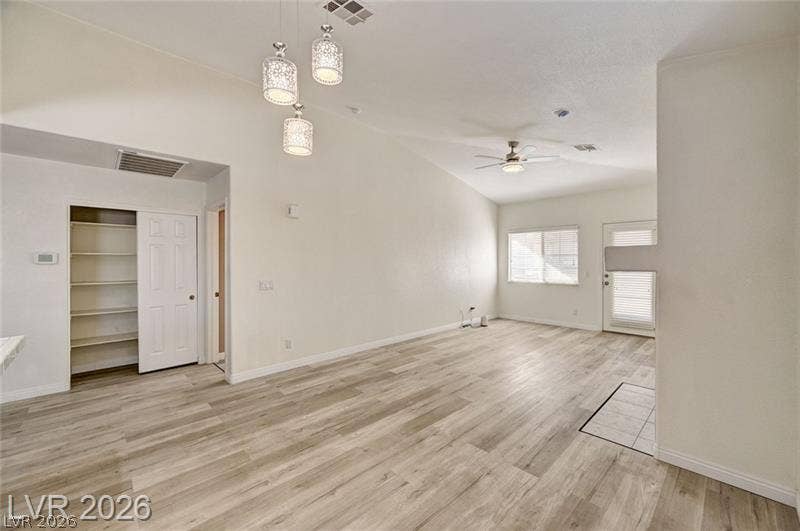 3327 Erva Street, #207, Las Vegas, NV 89117 Vaulted ceilings and wood-style flooring enhance this open, airy living space.