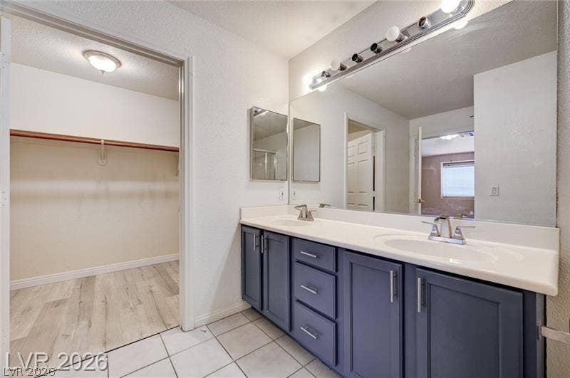 3327 Erva Street, #207, Las Vegas, NV 89117 A spacious vanity area connects seamlessly to a walk-in closet with built-in storage.