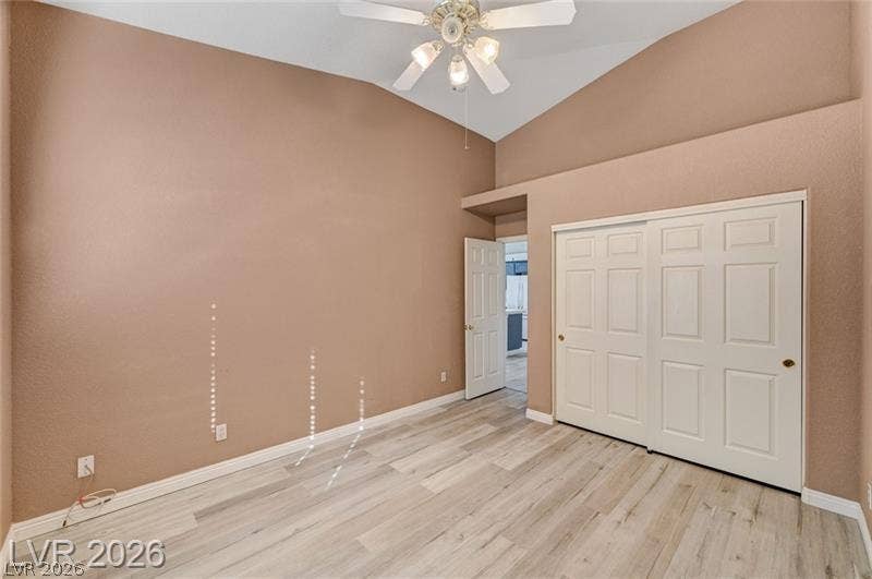 3327 Erva Street, #207, Las Vegas, NV 89117 Vaulted ceilings and wood-look laminate flooring define this comfortable secondary bedroom.
