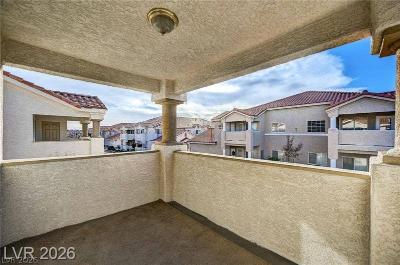 3327 Erva Street, #207, Las Vegas, NV 89117 Sheltered balcony overlooks the neighborhood under open skies.
