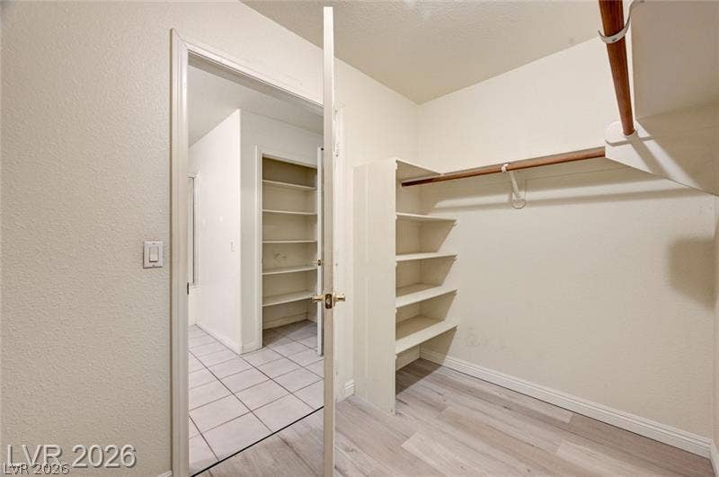 3327 Erva Street, #207, Las Vegas, NV 89117 Ample closet space features integrated wooden shelving and durable plank flooring.