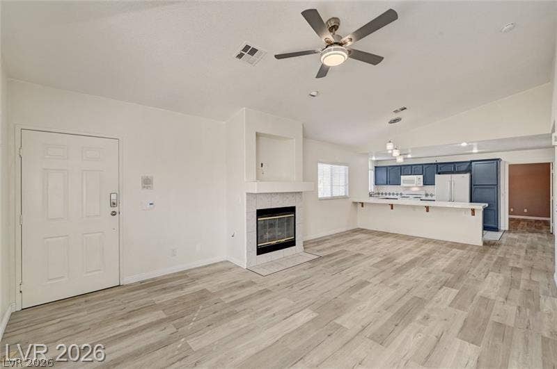 3327 Erva Street, #207, Las Vegas, NV 89117 An inviting open floorplan seamlessly connects the living space with a modern breakfast bar kitchen.