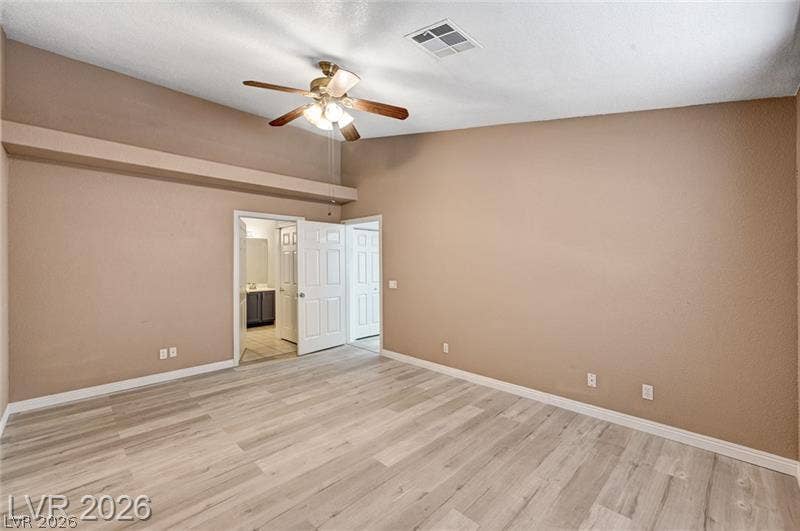3327 Erva Street, #207, Las Vegas, NV 89117 High ceilings and durable wood-look flooring enhance this versatile bedroom space.