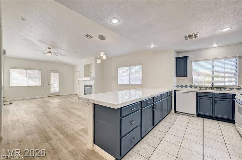 3327 Erva Street, #207, Las Vegas, NV 89117 An open floor plan seamlessly connects the kitchen to the spacious living area.
