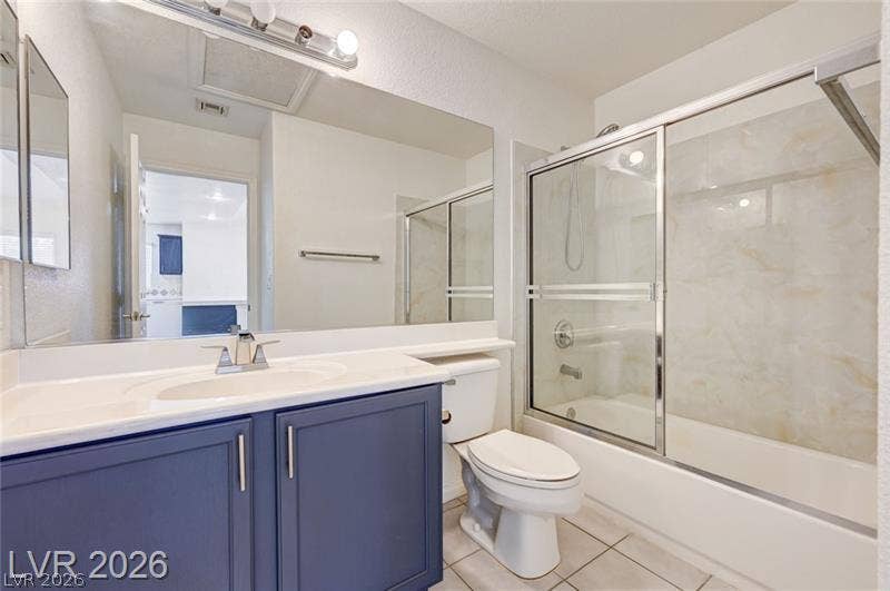 3327 Erva Street, #207, Las Vegas, NV 89117 A classic tiled shower and tub combination stands adjacent to the vanity area.