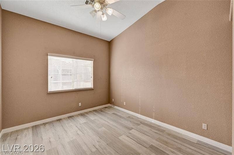 3327 Erva Street, #207, Las Vegas, NV 89117 Vaulted ceilings and wood-look flooring enhance this versatile bedroom space.