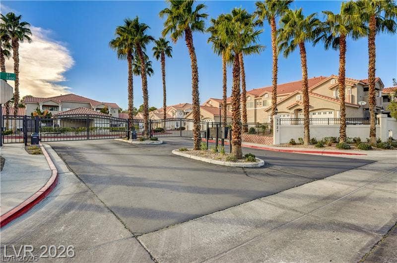 3327 Erva Street, #207, Las Vegas, NV 89117 Towering palm trees frame the gated entrance to this beautifully maintained residential community.