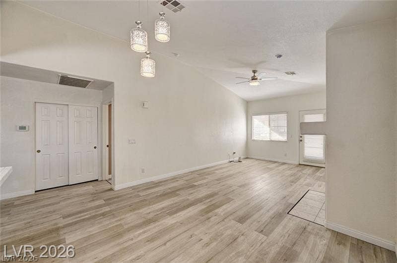 3327 Erva Street, #207, Las Vegas, NV 89117 Vaulted ceilings and wide-plank flooring define this airy, open living area.