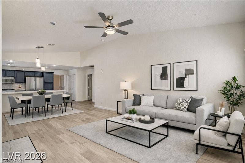 3327 Erva Street, #207, Las Vegas, NV 89117 Vaulted ceilings and wide-plank flooring define this open-concept main level floor plan.